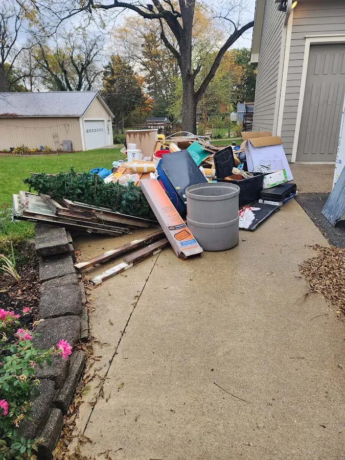 Dumpster being loaded with debris for 30 Yard Dumpster Rental in Onondaga